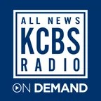 The KCBS Radio On Demand logo has navy blue and white text that reads "all news KBCBS radio on demand" in a white square background with blue frame.